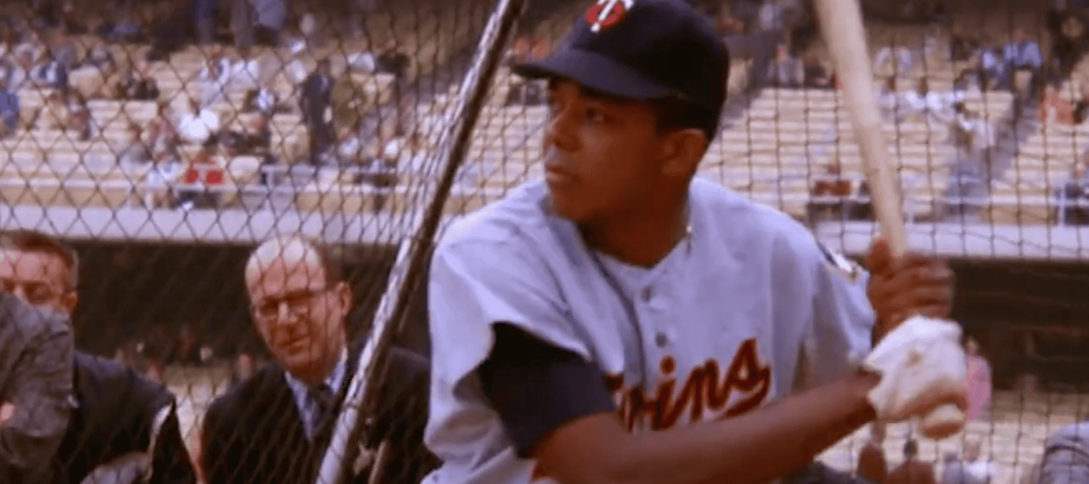 Tony Oliva in action, showcasing his batting skills as a legendary Twins player.